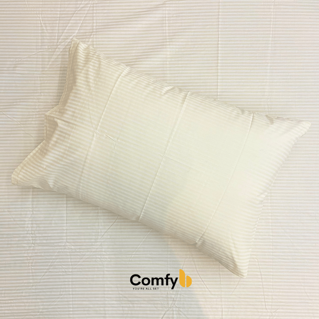 Elevate your bedding with Comfyb Stripes Poly Cotton 50/50 Fitted Sheet Sets, featuring a striped fitted sheet and pillowcases in soft tones. Crafted from a 50/50 poly-cotton blend, these sets require no ironing. Available in single (two 120×200+30 cm fitted sheets, two 50×75 cm pillowcases), double (180×200+30 cm fitted sheet, two 50×75 cm pillowcases), and king sizes (200×200+30 cm fitted sheet, two 50×75 cm pillowcases), each ensures a comfortable night's sleep.