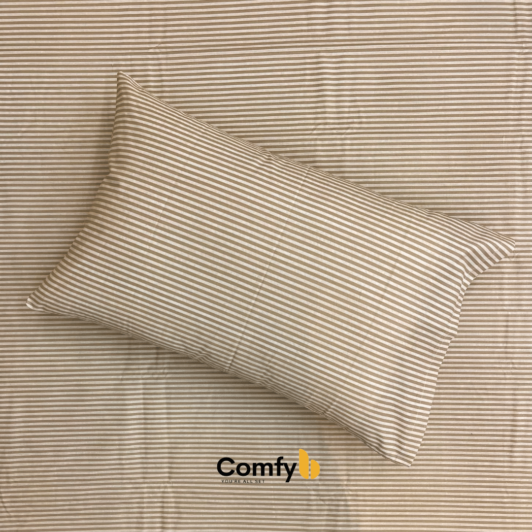 Elevate your bedding with Comfyb Stripes Poly Cotton 50/50 Fitted Sheet Sets, featuring a striped fitted sheet and pillowcases in soft tones. Crafted from a 50/50 poly-cotton blend, these sets require no ironing. Available in single (two 120×200+30 cm fitted sheets, two 50×75 cm pillowcases), double (180×200+30 cm fitted sheet, two 50×75 cm pillowcases), and king sizes (200×200+30 cm fitted sheet, two 50×75 cm pillowcases), each ensures a comfortable night's sleep.